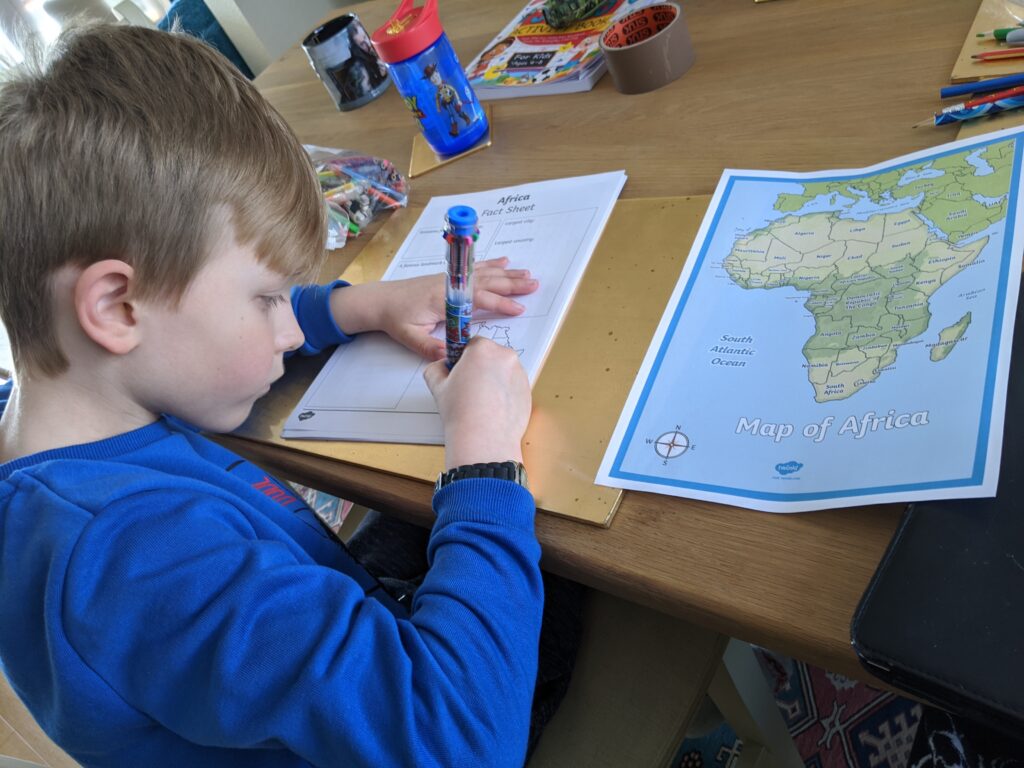 Boy studying work while being homeschooled