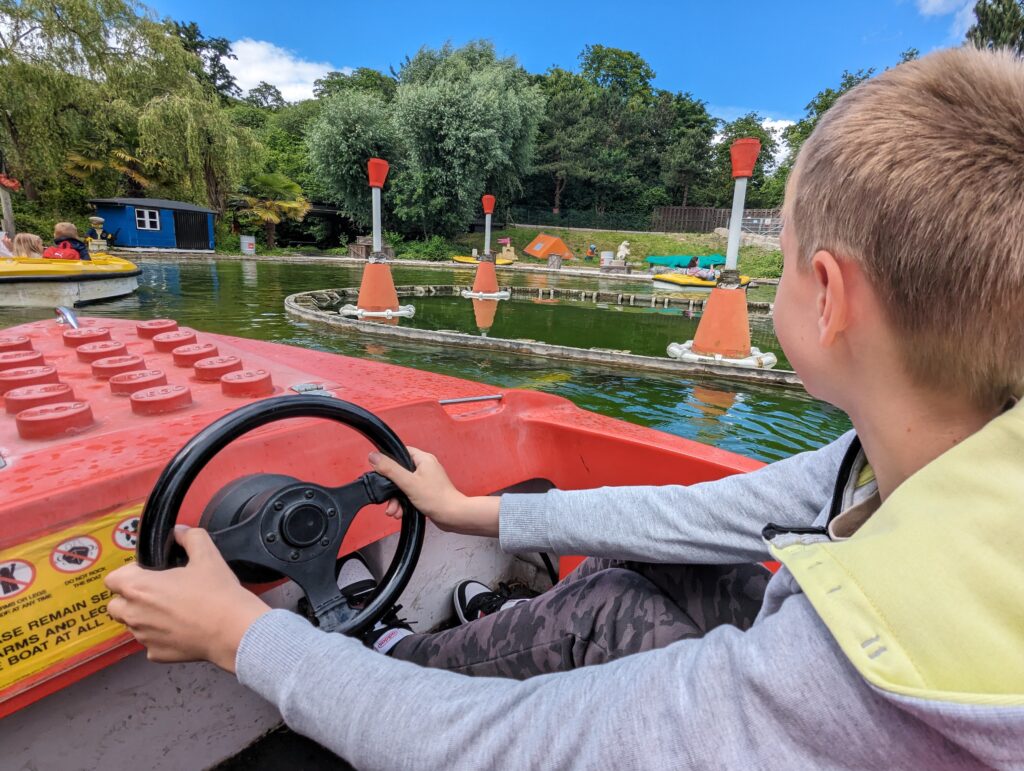 Boy on the mini LEGO boat ride at LEGOLAND Windsor
