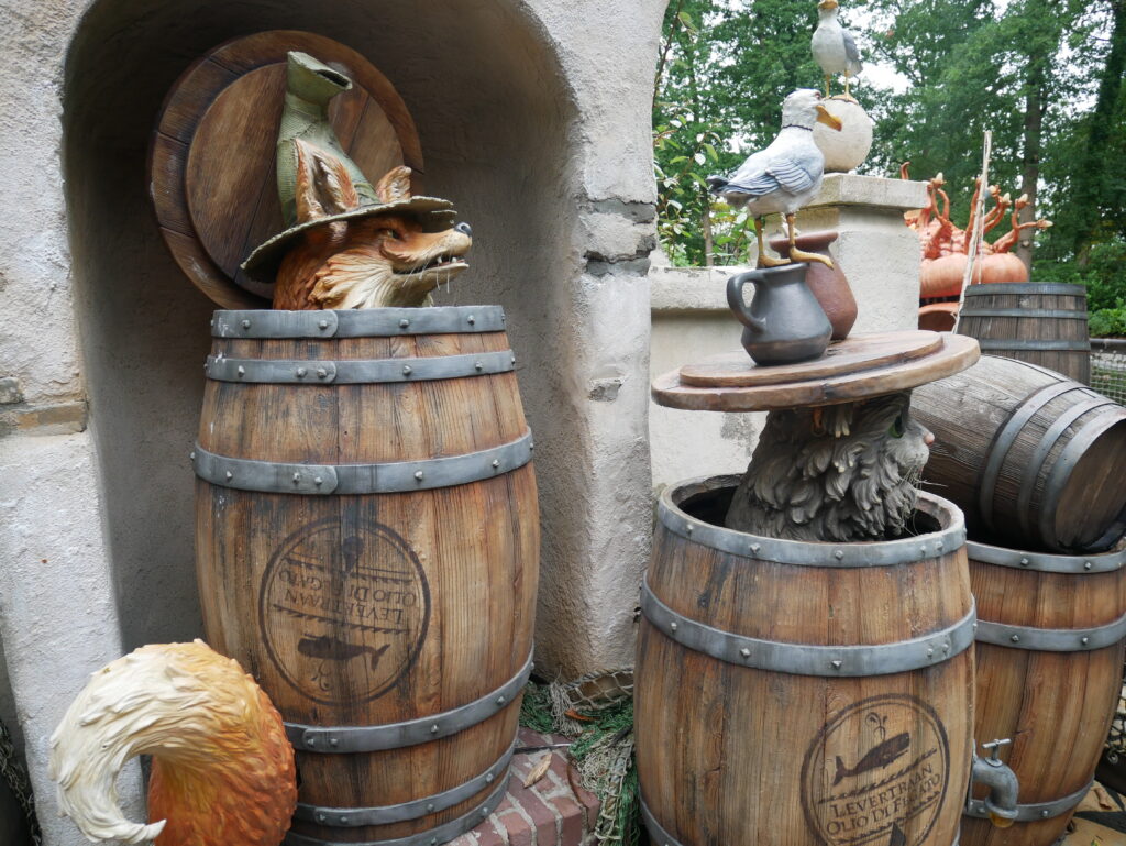 animals peering out of barrels - Exploring the Fairytale Forest at Efteling