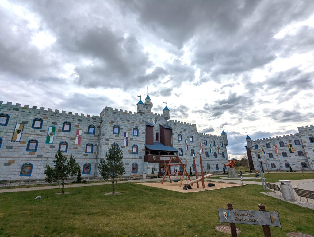 front of the legoland castle hotel in Billund Denmark with another play area