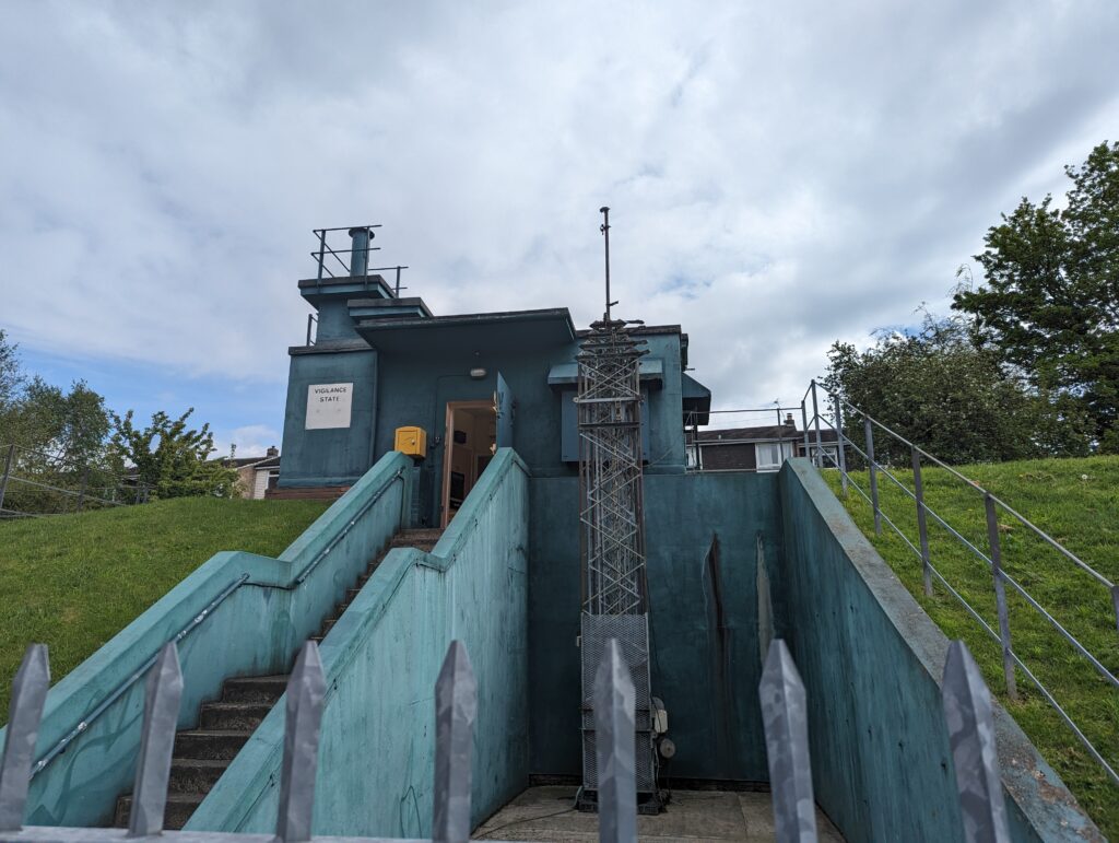 Historic York water pump station with stairs and safety fencing.