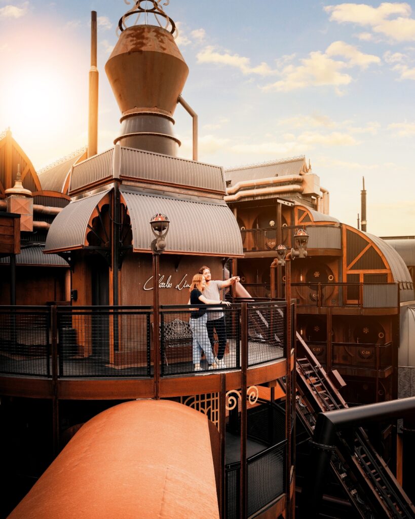 View of a couple at the Phantasialand that has the rollercoaster running next to it