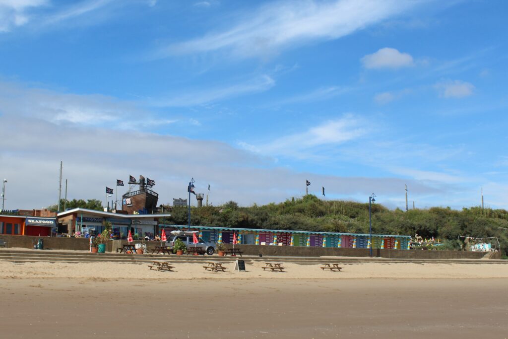 View of the beach at Mablethorpe with beach huts and plenty of sand