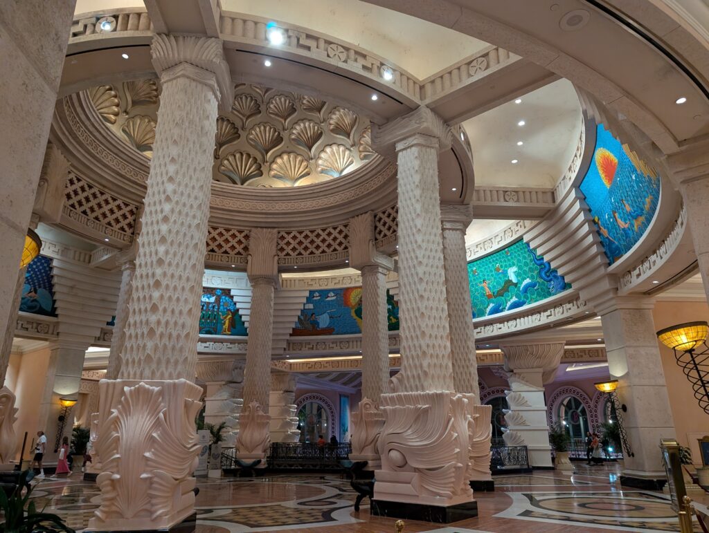 The spectacular entrance lobby with Roman columns and sea murals at the Royal Atlantis Bahamas