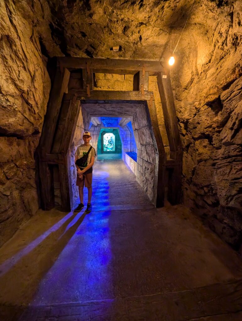Child standing in one of the themed areas of the Dig Atlantis Bahamas