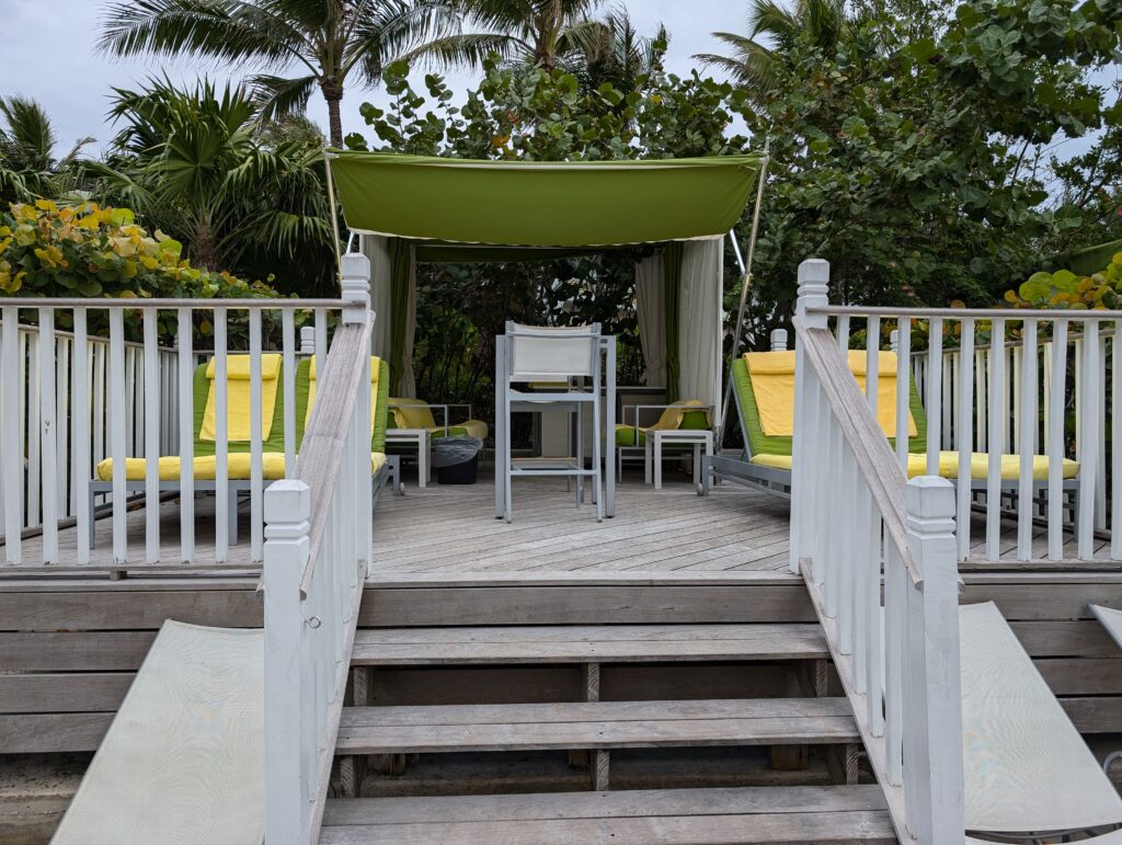 A cabana that you can rent with steps and seats at Atlantis Bahamas waterpark