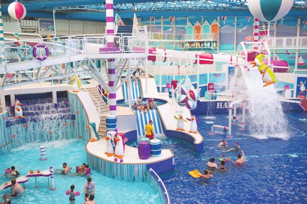 View of people in the indoor pool and slides at Craig Tara Haven