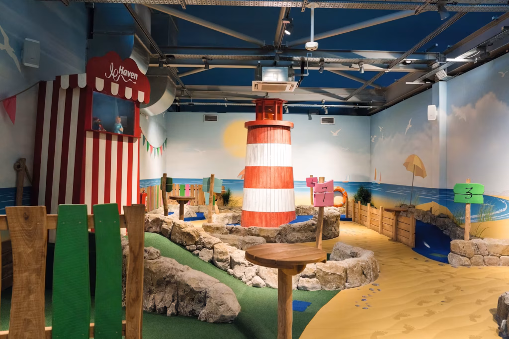 Indoor crazy golf with fun theming including a lighthouse at Craig Tara Haven