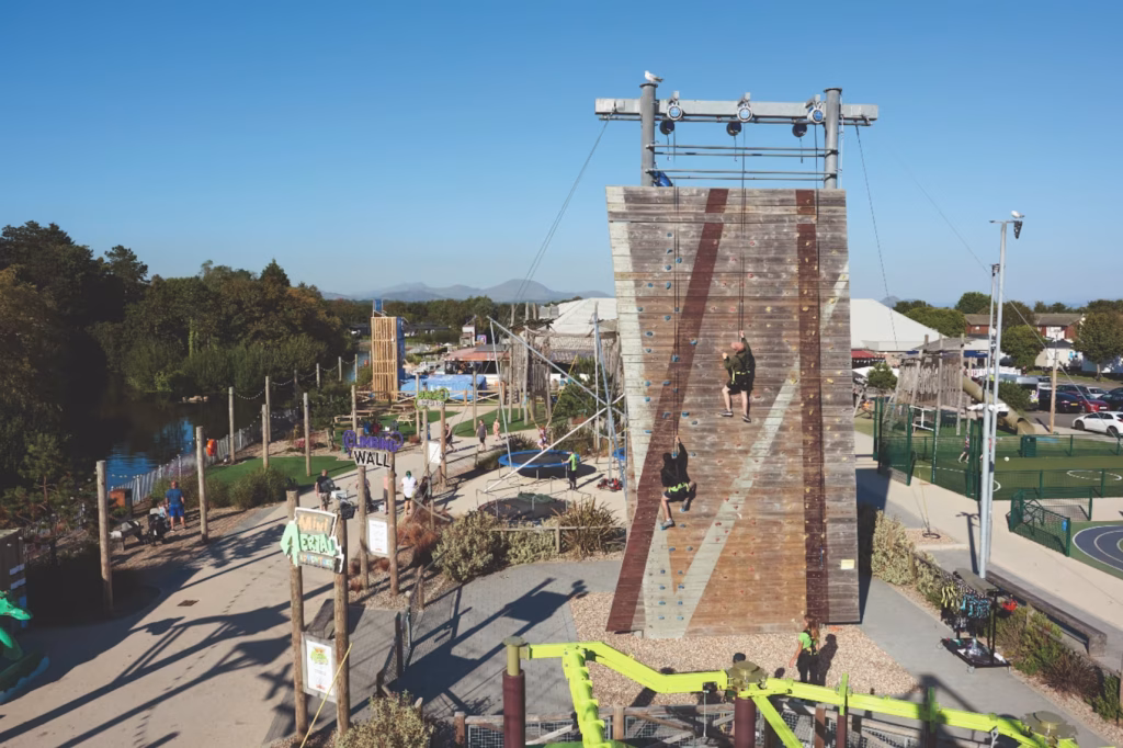 Outdoor facilities including the climbing wall at Hafan Y Mor Wales