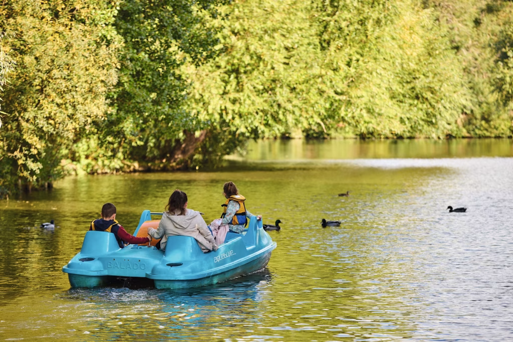 People in a pedalo on the lake at Primrose Valley Haven North Yorkshire