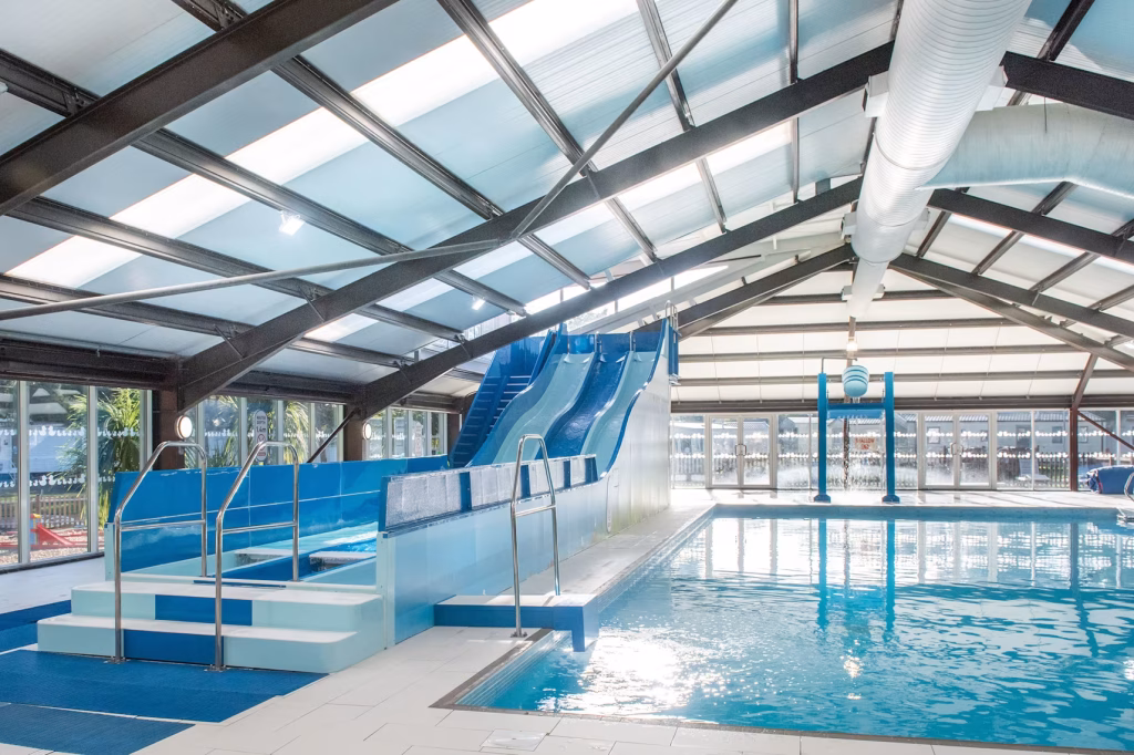 The indoor pool with slides and splash area at Wild Duck Haven