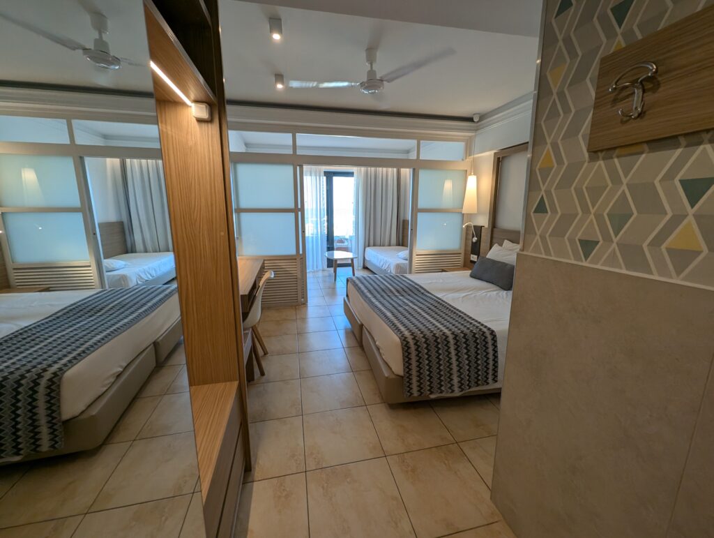 family room with sliding doors at the Kiani Beach Resort
