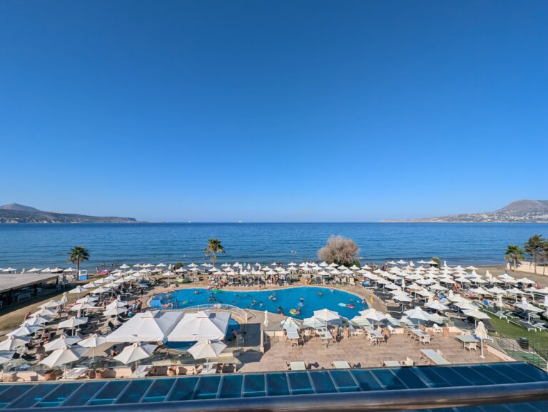 view of the beach pool and umbrellas at the Kiani Beach Resort