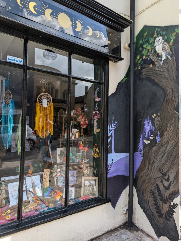Glastonbury mural and quirky shop in the town