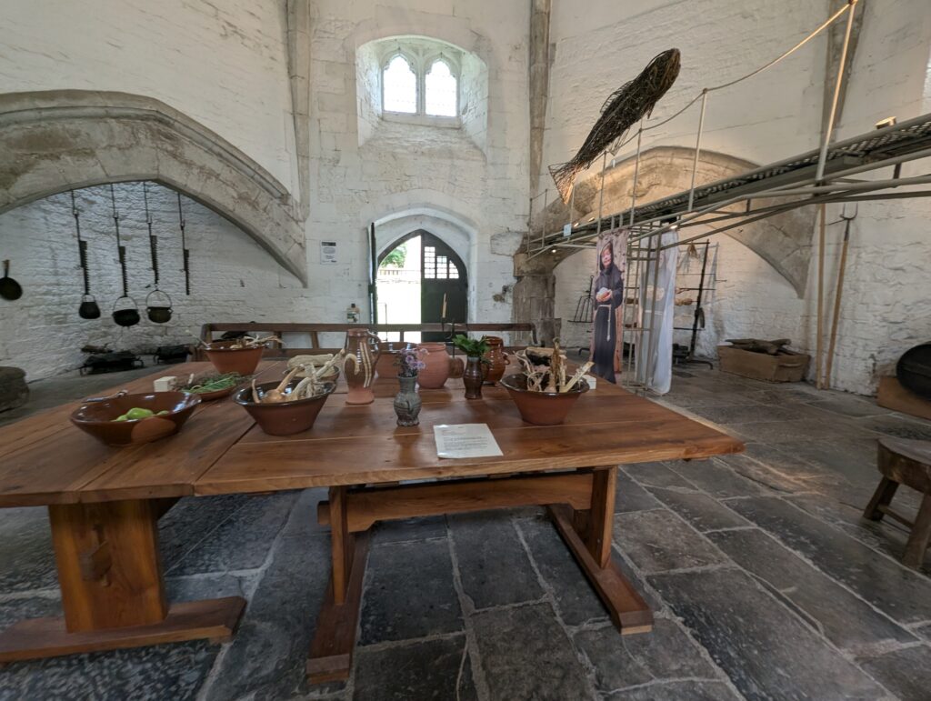 Glastonbury Abbey inside the kitchen table set out for dinner