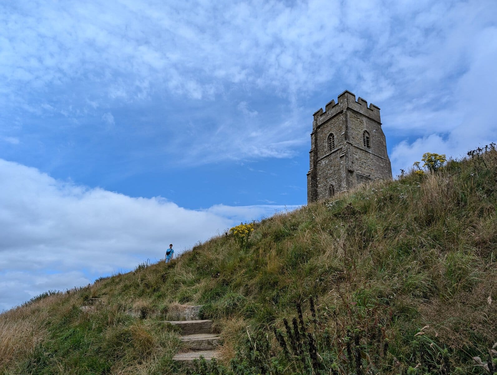 Glastonbury Tor steep steps to the top child in background