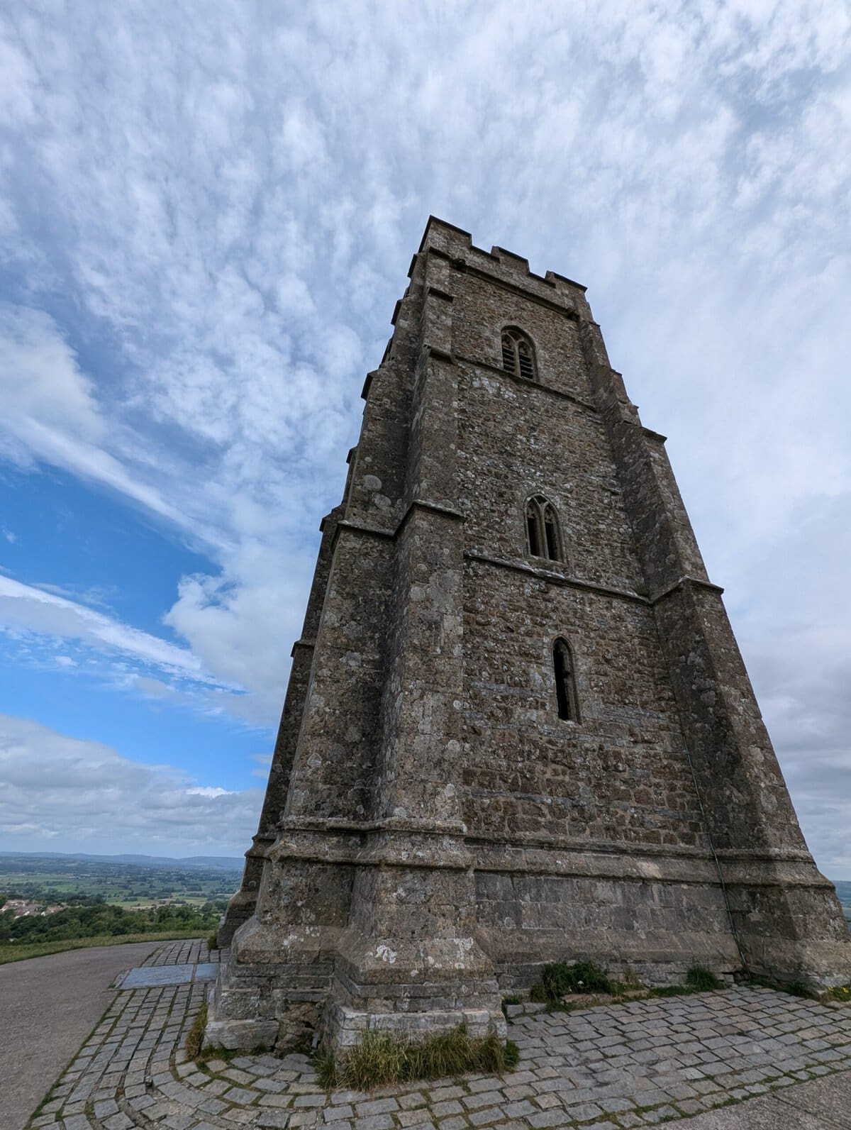 Glastonbury Tor at the top of the hill looking at the building